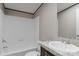 This bathroom features a shower-tub combo and a granite-look vanity with a stylish sink at 1380 St. Johns Church Rd, Concord, NC 28025