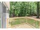 Close-up of the wooden deck with a view of the lush green backyard at 1380 St. Johns Church Rd, Concord, NC 28025