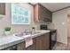 Well-equipped kitchen featuring a sink, oven, and marbled countertops at 1380 St. Johns Church Rd, Concord, NC 28025
