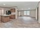 Open kitchen with modern island, countertops and wood-look floors at 1380 St. Johns Church Rd, Concord, NC 28025