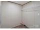Walk-in closet featuring modern wood-look floors and a wire shelf at 1380 St. Johns Church Rd, Concord, NC 28025