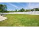 Expansive, well-manicured backyard enclosed by a white fence, offering privacy and a large lawn area at 1437 Imperial Ct, York, SC 29745