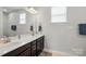 Bathroom with double vanity and a modern white countertop with bronze faucets at 1437 Imperial Ct, York, SC 29745