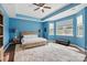 Spacious Primary bedroom with a trey ceiling, bright blue walls, and lots of natural light at 1437 Imperial Ct, York, SC 29745