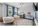 Light-filled bedroom features large windows, cozy beanbag chairs, and functional study desks at 1437 Imperial Ct, York, SC 29745