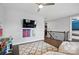 Cozy bedroom with mounted TV, two desks, and a hallway view at 1437 Imperial Ct, York, SC 29745