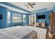 Large Primary bedroom with bright blue walls, a ceiling fan, and ample natural light at 1437 Imperial Ct, York, SC 29745