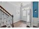 Welcoming foyer with hardwood floors, staircase, and stylish lighting fixture at 1437 Imperial Ct, York, SC 29745