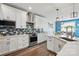Bright kitchen features white cabinets, quartz countertops, and stainless steel appliances at 1437 Imperial Ct, York, SC 29745