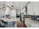 Kitchen with stainless appliances, white cabinets, subway tile backsplash and view to living space at 1437 Imperial Ct, York, SC 29745