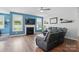 Inviting living room featuring hardwood floors, a fireplace, and bright window views at 1437 Imperial Ct, York, SC 29745