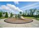 Community playground featuring a slide and play structures, set in a grassy area with benches at 1437 Imperial Ct, York, SC 29745