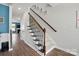Staircase leading to upper floor features carpeted steps and dark wood handrail at 1437 Imperial Ct, York, SC 29745