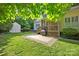 Large backyard with a screened-in porch, shed, and brick-edged patio ideal for relaxation and storage at 14505 Sunset Walk Ln, Huntersville, NC 28078