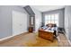 Comfortable bedroom with hardwood floors, neutral walls, and natural light for a soothing space at 14505 Sunset Walk Ln, Huntersville, NC 28078