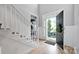 Bright foyer with hardwood floors, staircase, and a view of the front yard through the open door at 14505 Sunset Walk Ln, Huntersville, NC 28078