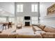 Spacious living room featuring a fireplace, vaulted ceiling, and a comfortable seating area, perfect for relaxing at 14505 Sunset Walk Ln, Huntersville, NC 28078