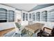 Stylish office featuring custom built-in shelves, a wooden desk, and comfortable seating on a soft rug at 14505 Sunset Walk Ln, Huntersville, NC 28078