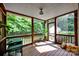 Inviting screened porch with wood ceiling and floor, offering peaceful views of the lush backyard at 14505 Sunset Walk Ln, Huntersville, NC 28078