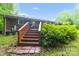 Backyard with stairs leading to the patio; perfect for enjoying your privacy in this outdoor space at 151 Deja Ln, Cleveland, NC 27013