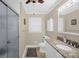 Well-lit bathroom with granite countertops, a modern sink, updated cabinets and a tiled shower at 151 Deja Ln, Cleveland, NC 27013