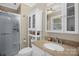 Modern bathroom featuring a glass shower, granite countertop and bright vanity lighting at 151 Deja Ln, Cleveland, NC 27013
