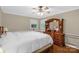 Bright bedroom with wood floors, a traditional bed frame, and a wooden dresser at 151 Deja Ln, Cleveland, NC 27013