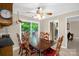Cozy eat-in kitchen with an adjacent deck offers a serene view of the wooded backyard at 151 Deja Ln, Cleveland, NC 27013