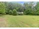 Ranch home with large yard and mature trees providing a sense of peace and tranquility at 151 Deja Ln, Cleveland, NC 27013
