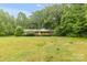 Charming ranch home nestled on a large lot, surrounded by mature trees and landscaping at 151 Deja Ln, Cleveland, NC 27013