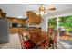 Eat-in kitchen features wood cabinetry, a dining table, and sliding glass doors to an outdoor deck at 151 Deja Ln, Cleveland, NC 27013
