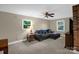 Inviting living room with a cozy couch, carpeted floor, ceiling fan and natural light at 151 Deja Ln, Cleveland, NC 27013