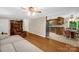 Open-concept living area with hardwood floors flowing into a dining area and connected kitchen at 151 Deja Ln, Cleveland, NC 27013