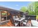 Relaxing outdoor patio with table and chairs, surrounded by trees and a hot tub at 151 Deja Ln, Cleveland, NC 27013
