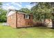 The backyard of this brick home is spacious, grassy and has nice landscaping at 16 Green St, York, SC 29745