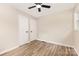 Bedroom with laminate flooring, a ceiling fan, and white doors at 16 Green St, York, SC 29745