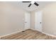 View of a bedroom with a ceiling fan and neutral walls, and wood look flooring at 16 Green St, York, SC 29745