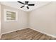 Cozy bedroom with a ceiling fan and ample natural light, providing a relaxing atmosphere at 16 Green St, York, SC 29745