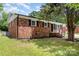Charming brick home with black shutters and landscaped front yard at 16 Green St, York, SC 29745