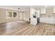 Open-concept living area seamlessly blends into a modern kitchen, perfect for entertaining at 16 Green St, York, SC 29745