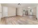 Open-concept living area with sleek floors, neutral paint, and a modern aesthetic at 16 Green St, York, SC 29745