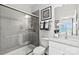 Modern bathroom features a glass-enclosed shower and a white vanity with elegant fixtures and decor at 162 Nicholson Ln, Mooresville, NC 28115