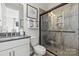 Modern bathroom features a glass-enclosed shower, neutral color palette, and stylish fixtures and decor at 162 Nicholson Ln, Mooresville, NC 28115