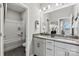 This neutral bathroom features an open doorway into a tub and shower combination at 162 Nicholson Ln, Mooresville, NC 28115