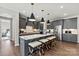 Open kitchen with granite island, stainless steel appliances, and pendant lights at 162 Nicholson Ln, Mooresville, NC 28115