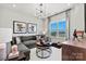Chic living room featuring a comfortable sectional sofa, modern lighting, and scenic views from the window at 162 Nicholson Ln, Mooresville, NC 28115
