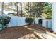 Fenced backyard with shade trees and a stone paver patio at 165 N Arcadian Way, Mooresville, NC 28117