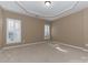 Neutral-toned bedroom featuring two windows and stylish ceiling design at 165 N Arcadian Way, Mooresville, NC 28117