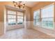 Dining room with a chandelier and large windows, providing ample natural light at 165 N Arcadian Way, Mooresville, NC 28117