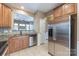 Updated kitchen features stainless steel appliances, granite countertops and breakfast bar at 165 N Arcadian Way, Mooresville, NC 28117
